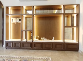 a living room with a large entertainment center