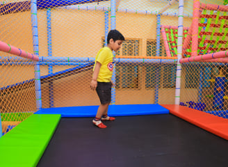 Child jumping on trampoline