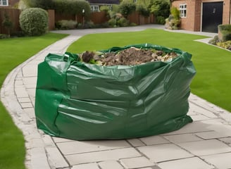 green metal garden shovel filled with brown soil