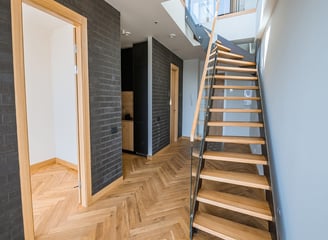 a staircase leading to a second floor bedroom