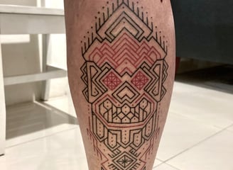 An handpoked tattoo featuring combinasi geomatrics tappis lines symmatric, tattoo on leg