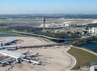 a large airport with a lot of airplanes and planes