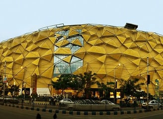 a large yellow building with a large yellow dome