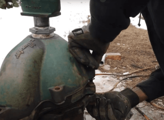 Technician installing well head
