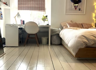 Bedroom with hand painted floorboards