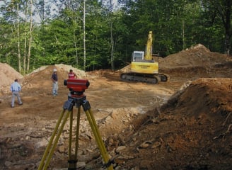 a man standing in front of a construction site