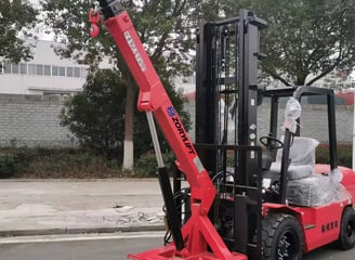 Zorylift forklift crane attachment on red forklift, ready for operation.