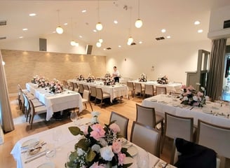 Restaurant set up with floral centerpieces