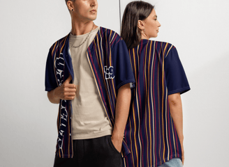 a man and woman standing next to each other both showcasing YESHUA Apparel jerseys