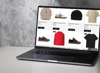 a laptop computer screen displaying YESHUA Apparel products