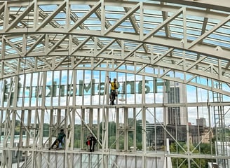 a group of people hanging from a ceiling