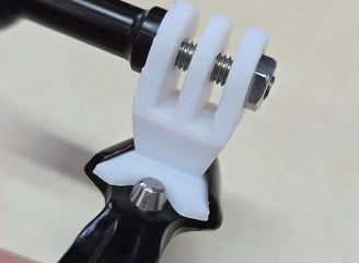 Uni-Mount white "Single" mount mounted on exposure clamp