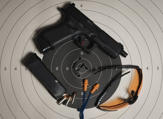 Glock Handgun, Ear plugs, safety glasses and range target for accuracy