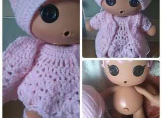 a doll doll with a pink crochet outfit and a pink hat made to measure