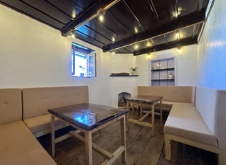 Bakhli Cafe with two L shaped sofas and tables