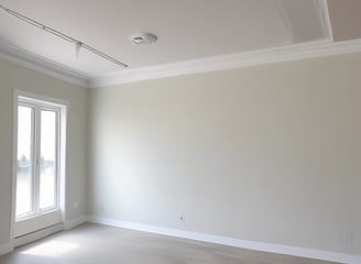 A person wearing a plaid shirt stands next to an organized tool bag filled with various tools such as screwdrivers, pliers, and a flashlight. A power drill, a can of cleaning spray, and coiled yellow cable are also visible. Lush greenery is present in the background.