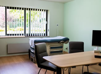 a room with a bed and a desk