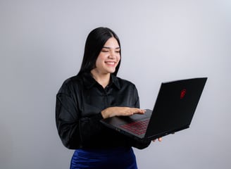 a woman in a black shirt and blue skirt