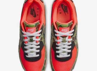 Nike Air Max 90 SP 'Reverse Duck Camo' (2020) sneaker in brown camo print with orange accents and retro trail-inspired design