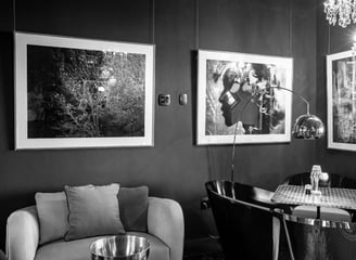 Framed b&w artwork displayed in a modern interior, showcasing picture framing service in Hout Bay