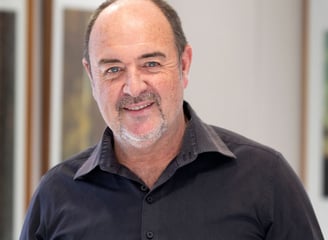 Portrait of Martin Osner, South African fine art photographer and visual artist, in his art gallery