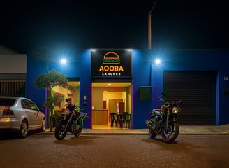 two motorcycles parked in front of a building