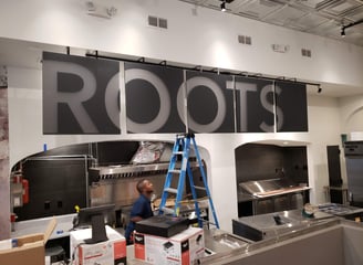 Multi-Panel Second Surface Ceiling Hanging Sign for Roots