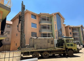 a truck with a crane on it's side and a crane on the other
