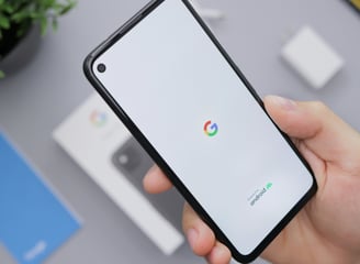 A person holding a phone in their hand.