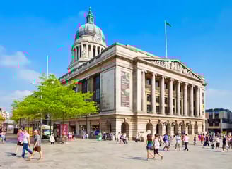 a large building with a dome shaped building in the middle of it