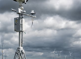 a person holding a tennis racket on a tennis court