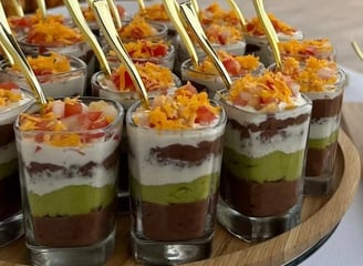a tray of desserts with a variety of desserts