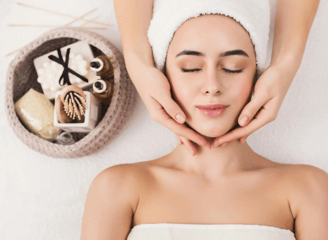 a woman getting a facial massage at a spa