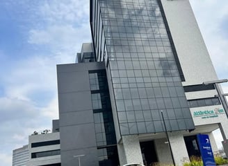 a large building with a sign that says, the building is a tall building