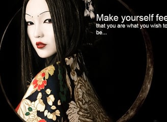 a woman with a black hair and a black and white mask