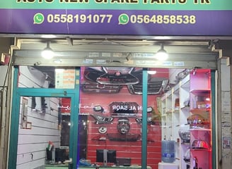 a shop front of a shopfront door with a car in the foreground