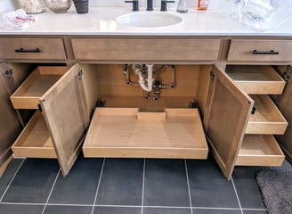 Pull-out shelving installed in a bathroom vanity.