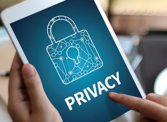 Picture of an Ipad with the word Privacy written on it and a lock image