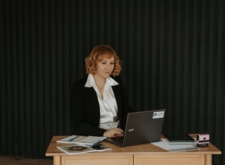 Stony Valley Employee at a desk with a laptop working.