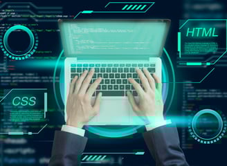 Pessoa digitando em um notebook com apoiado em mesa digital com imagens relacionadas a tecnologia