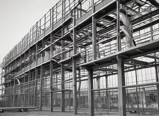 a man standing on a wooden floor next to a building