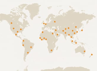 a map of a world map with orange dots
