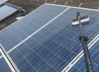 exterior cleaning services Fife - a extendable brush cleaning solar panels