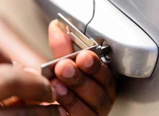 a person holding a cell phone in their hand