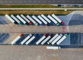 a parking lot with trucks parked in a parking lot