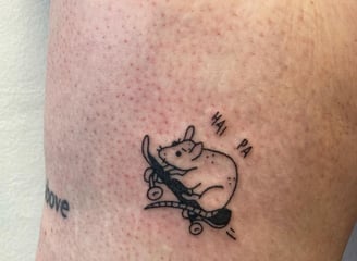 a tattoo of a mouse on the side of a person's leg made at Inari Tattoo