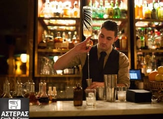 A bartender serving a drink