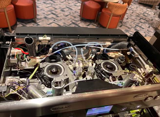 Internal top view of a Schaerer Barista coffee machine showing tubing and brewer unit.