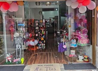 a storefront door with balloons and balloons