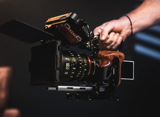 a person holding a camera and taking a picture